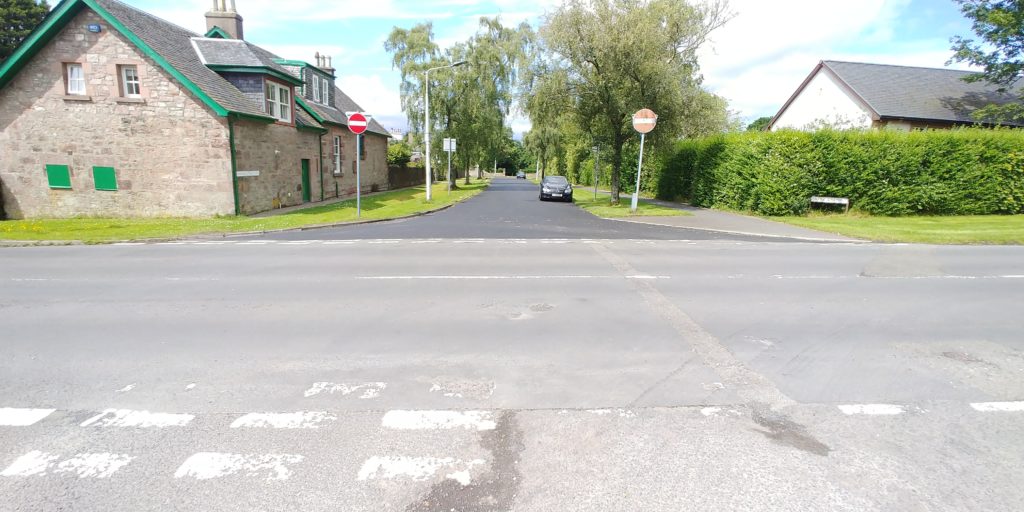 Looking across Charlotte Street at the newly resurfaced section of Grant Street