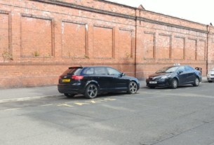 An entitled driver of a black Audi parks head on into the station rank