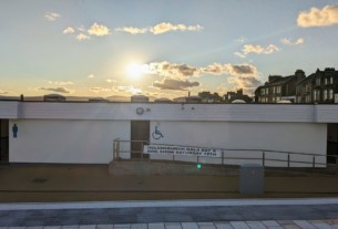 The public toilets at Helensburgh pier adorned with a banner for the gala day and dog show.