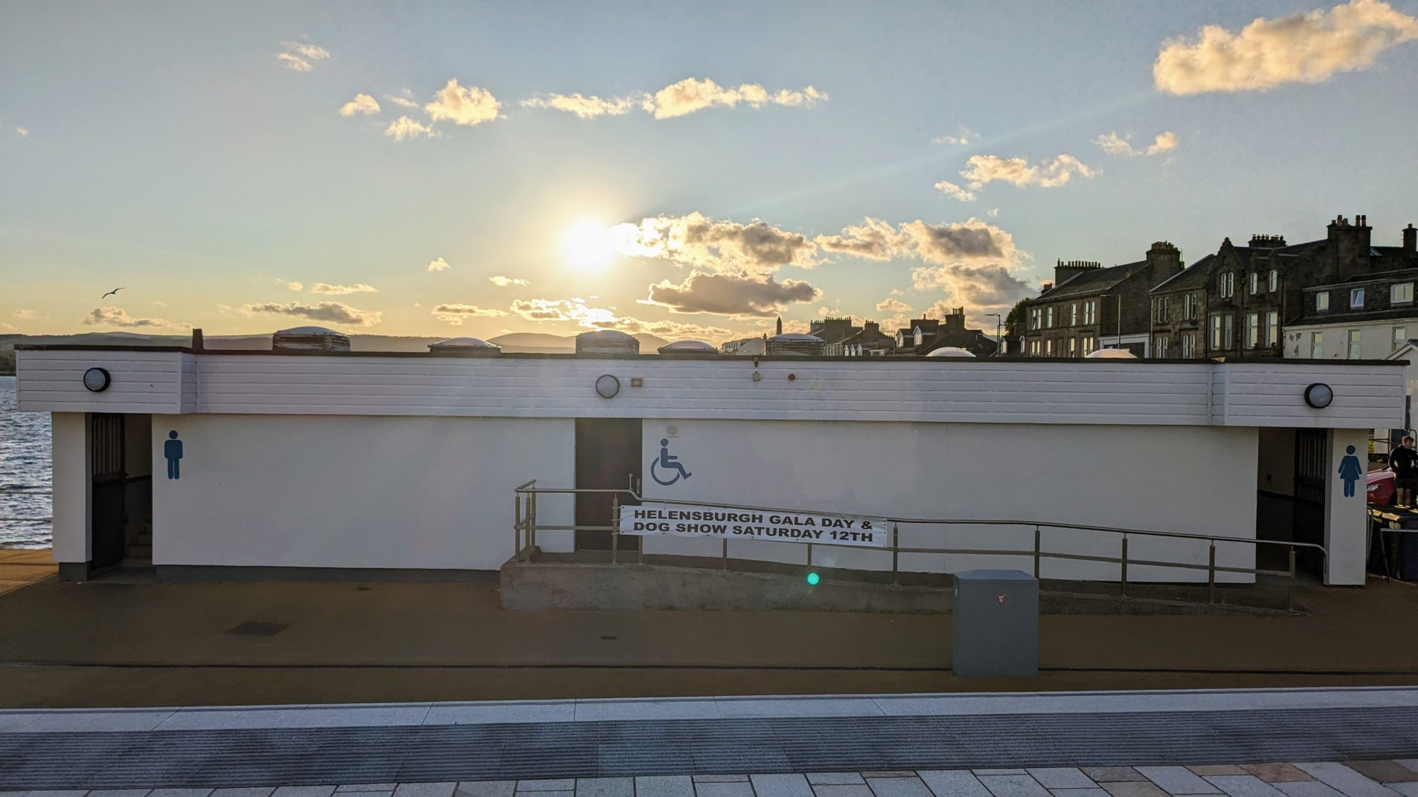 The public toilets at Helensburgh pier adorned with a banner for the gala day and dog show.